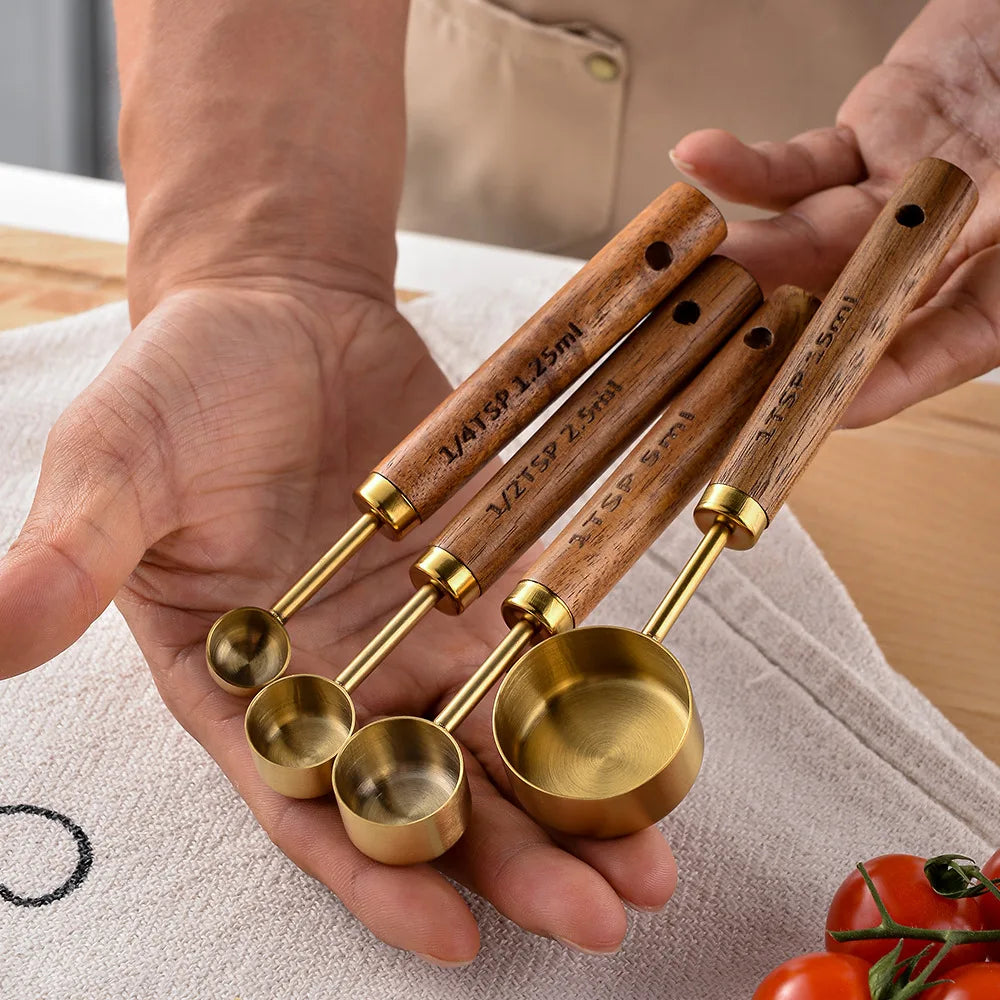 Stainless measuring cups with a wooden handle in a set